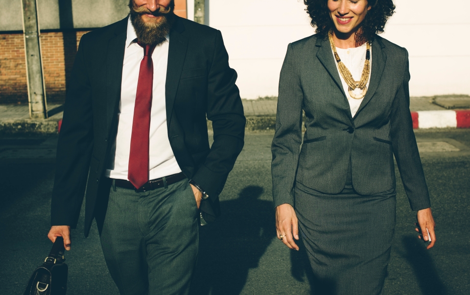 Business man and woman walking