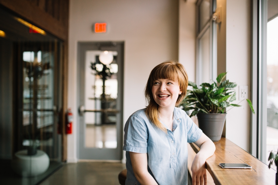Woman smiling at office table
